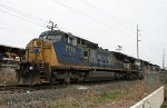 CSX 7779 is in the lead of NS train 349, parked north of the yard